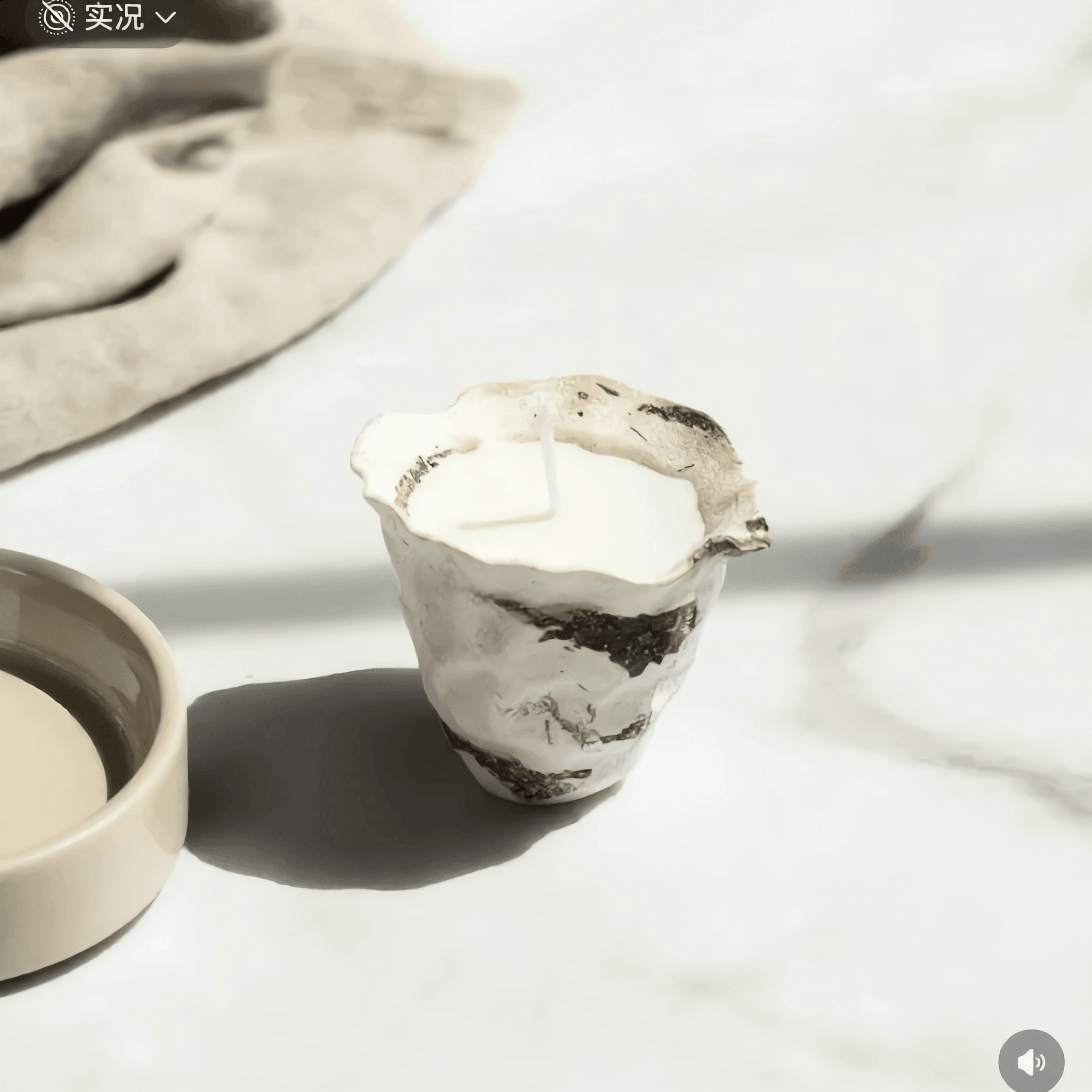 Clay pot cup with a textured design on a light surface