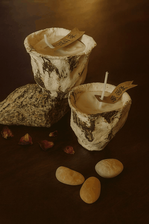 Rosewood scented candle by ONEKILN with elegant woody aroma and warm glow